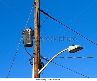 utility-pole-with-street-lamp-wires-and-transformer-bja8jn.jpg