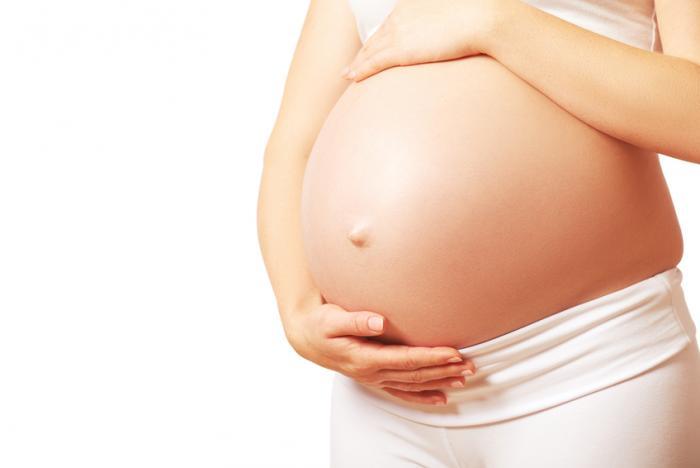 a-pregnant-women-with-both-hands-on-her-belly.jpg