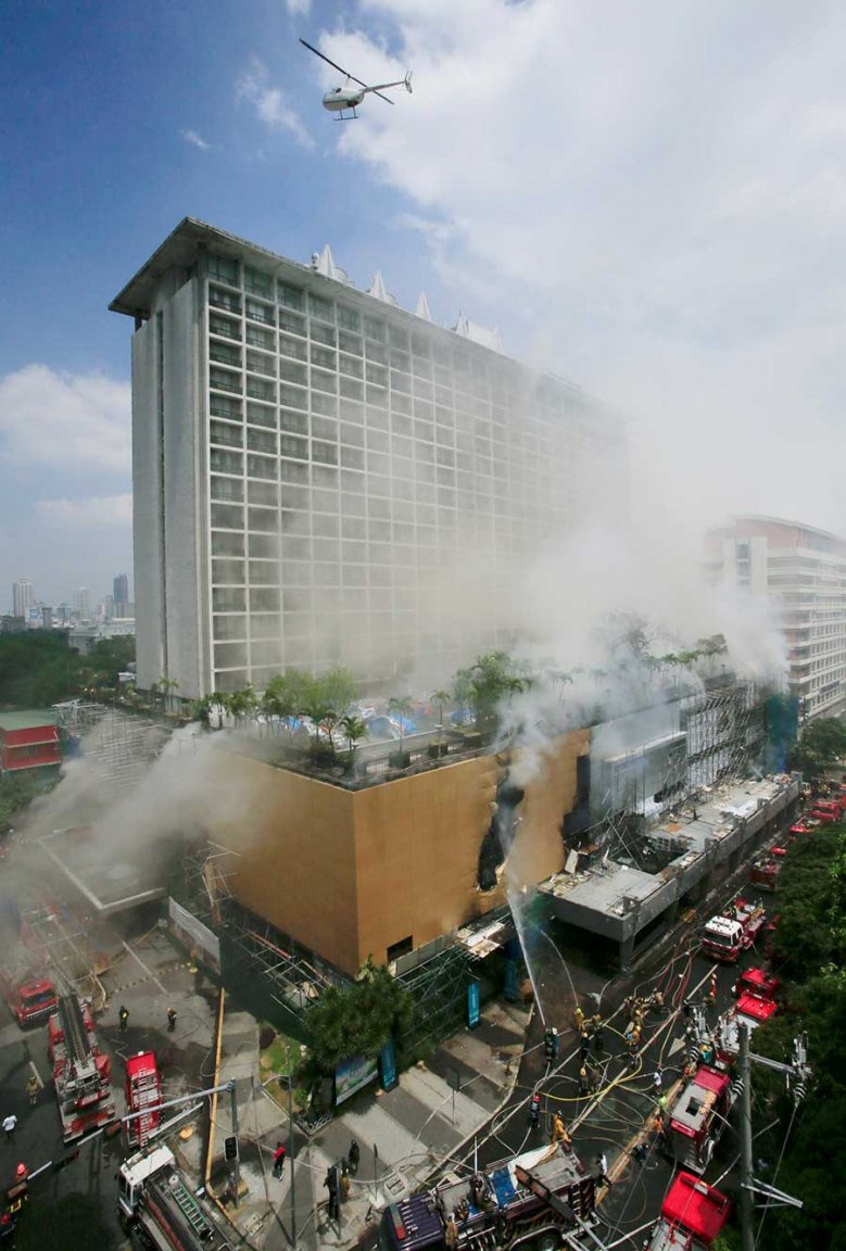 2018-03-18T112529Z_1_LYNXNPEE2H0AJ_RTROPTP_4_PHILIPPINES-FIRE.JPG