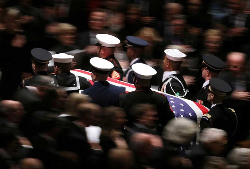 2018-12-05T223503Z_1_LYNXMPEEB41LH_RTROPTP_4_PEOPLE-BUSH.JPG