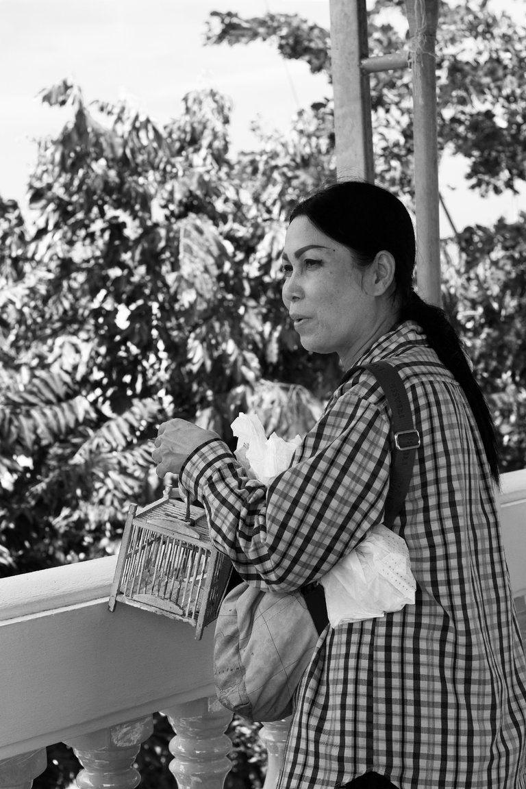 Pratumnak Woman releasing Bird.jpg