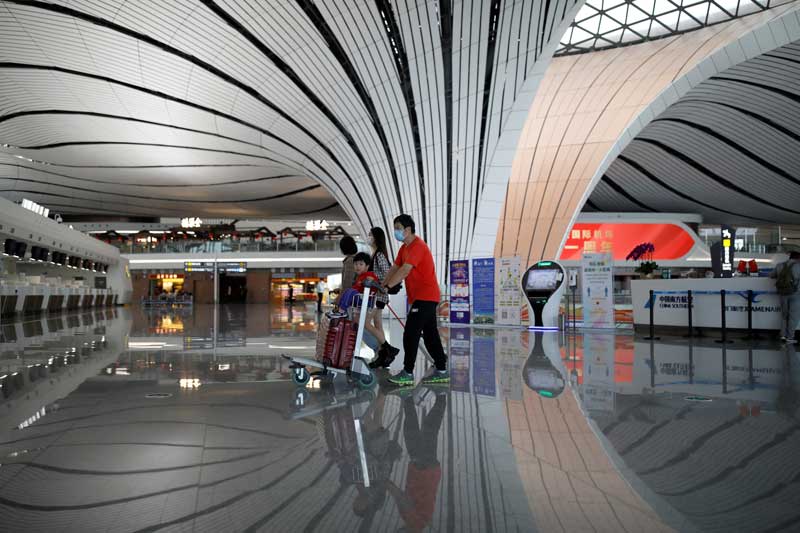 2020-10-22T034506Z_1_LYNXMPEG9L06Q_RTROPTP_4_HEALTH-CORONAVIRUS-CHINA-TRAVEL.JPG