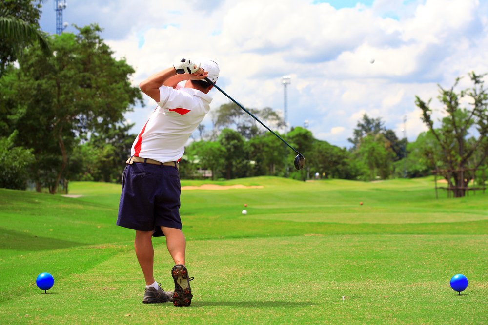 golf_man swing golf in nice golf course.jpg
