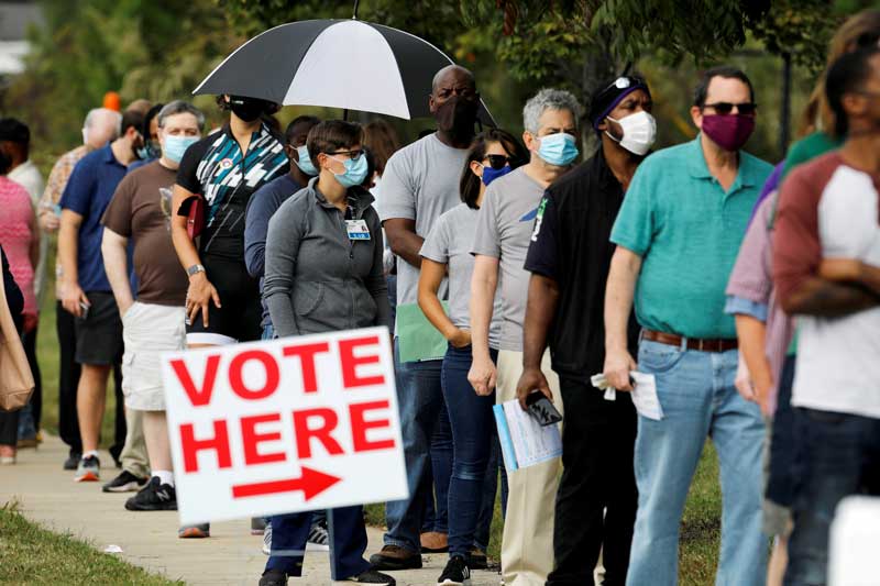 2020-11-18T110433Z_2_LYNXMPEGAH0QW_RTROPTP_4_USA-ELECTION-POLL-WORKERS.JPG