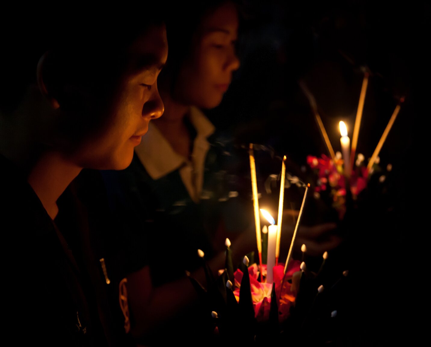 Couple Saying Prayer Before Launching Their Krathongs.jpg