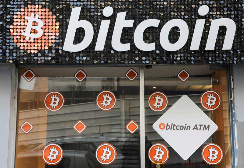 2021-02-08T205134Z_2_LYNXMPEH171E3_RTROPTP_4_CRYPTO-CURRENCY-TESLA.JPG