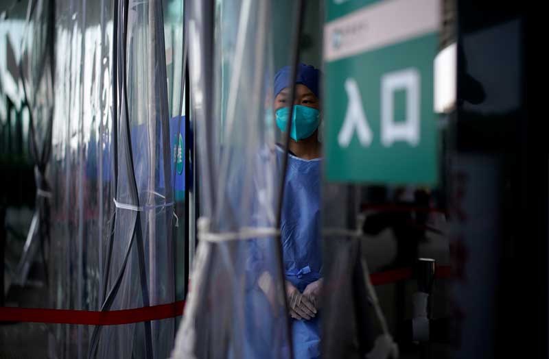 2021-02-24T040328Z_1_LYNXMPEH1N06N_RTROPTP_4_HEALTH-CORONAVIRUS-CHINA-WUHAN.JPG