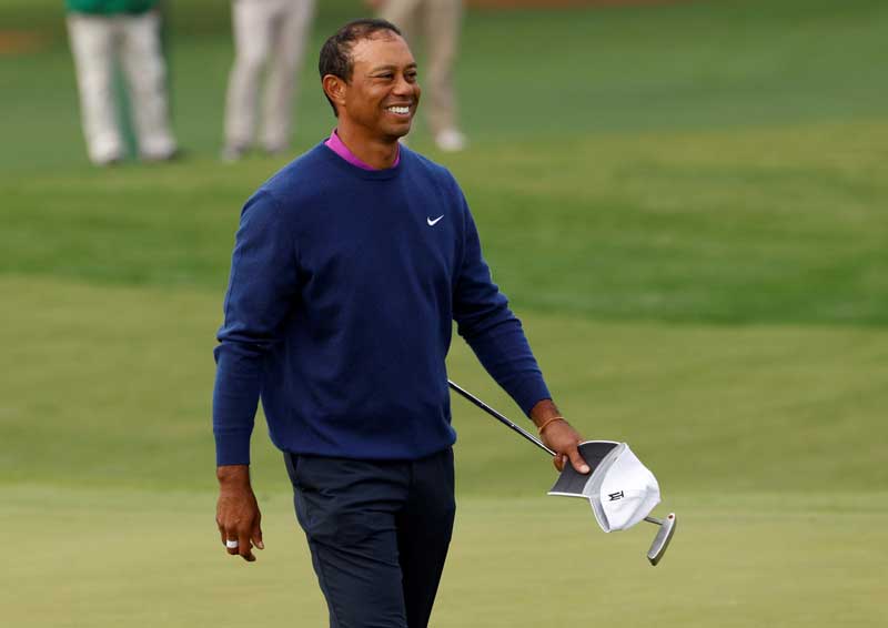 2021-03-01T013810Z_1_LYNXNPEH200IC_RTROPTP_4_PEOPLE-WOODS-GOLF.JPG