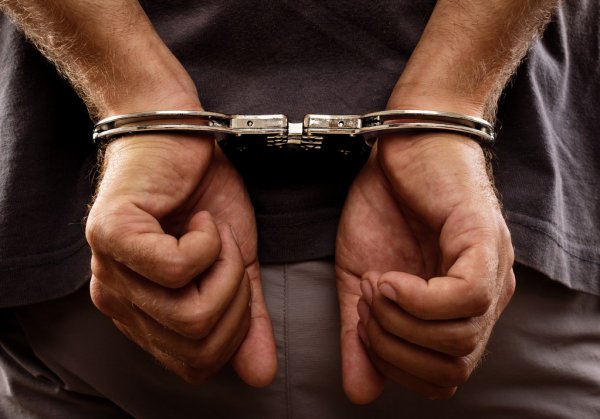 depositphotos_28109403-stock-photo-arrested-man-handcuffed-hands-at.jpg.bb059aa06ed9baee39b00592829bac96.jpg
