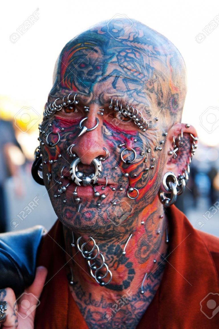 8150597-portrait-of-famous-dennis-lang-with-his-face-full-of-tattoos-and-piercings-.jpg