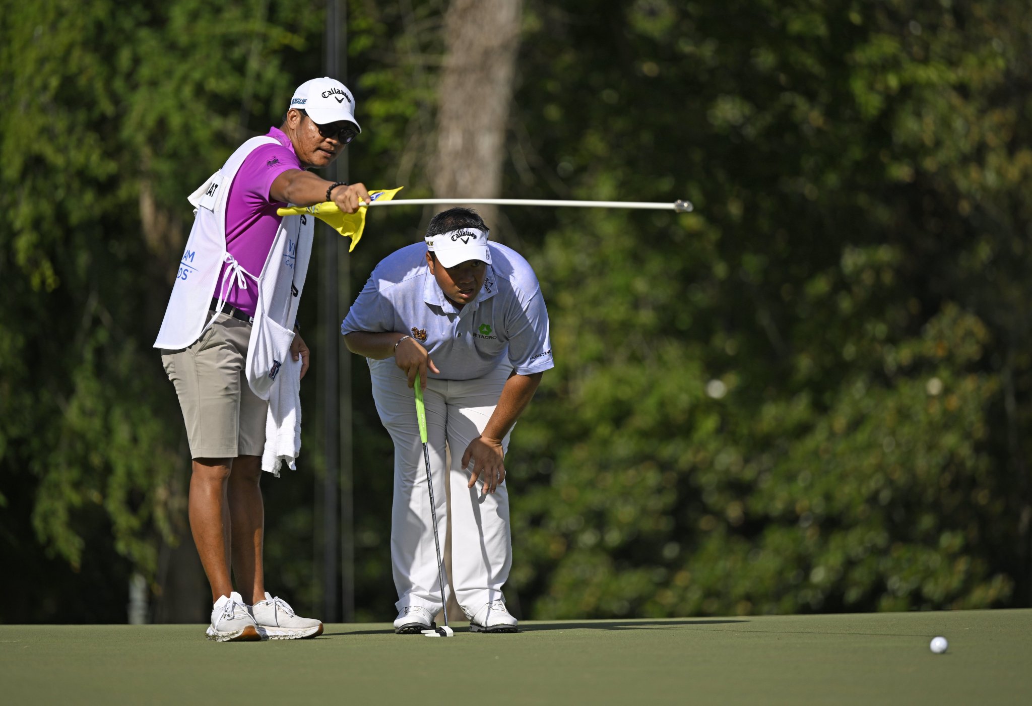 122495466_KiradechAphibarnratandcaddiePrajakKhaoprathumduringtheWyndhamChamionship.CreditGettyImages.thumb.jpg.1b4b4330375ebc0d78b7c6708f0d74d9.jpg