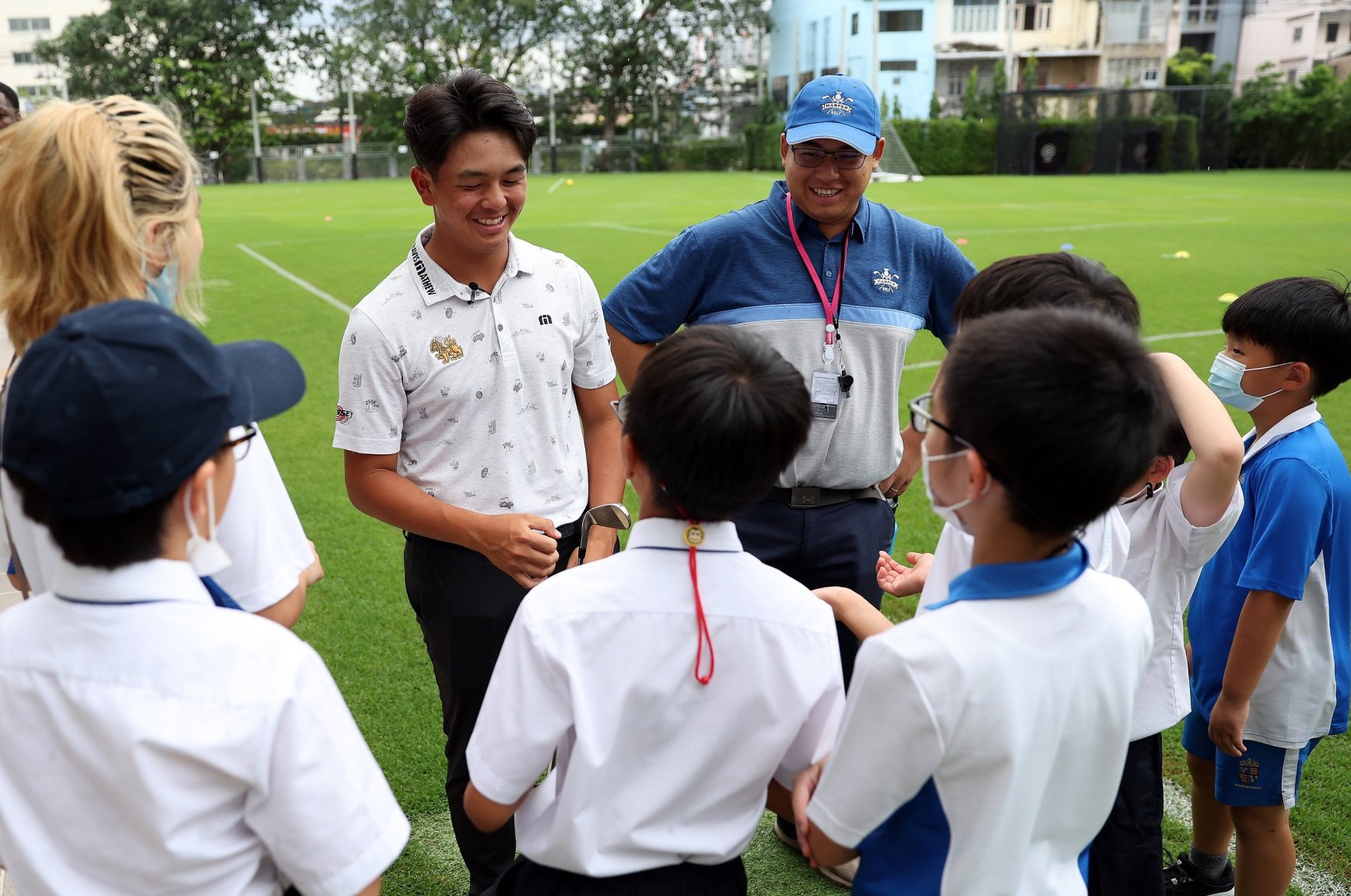 The golfing sensation held a lesson for a group of keen young golfers at his school.JPG
