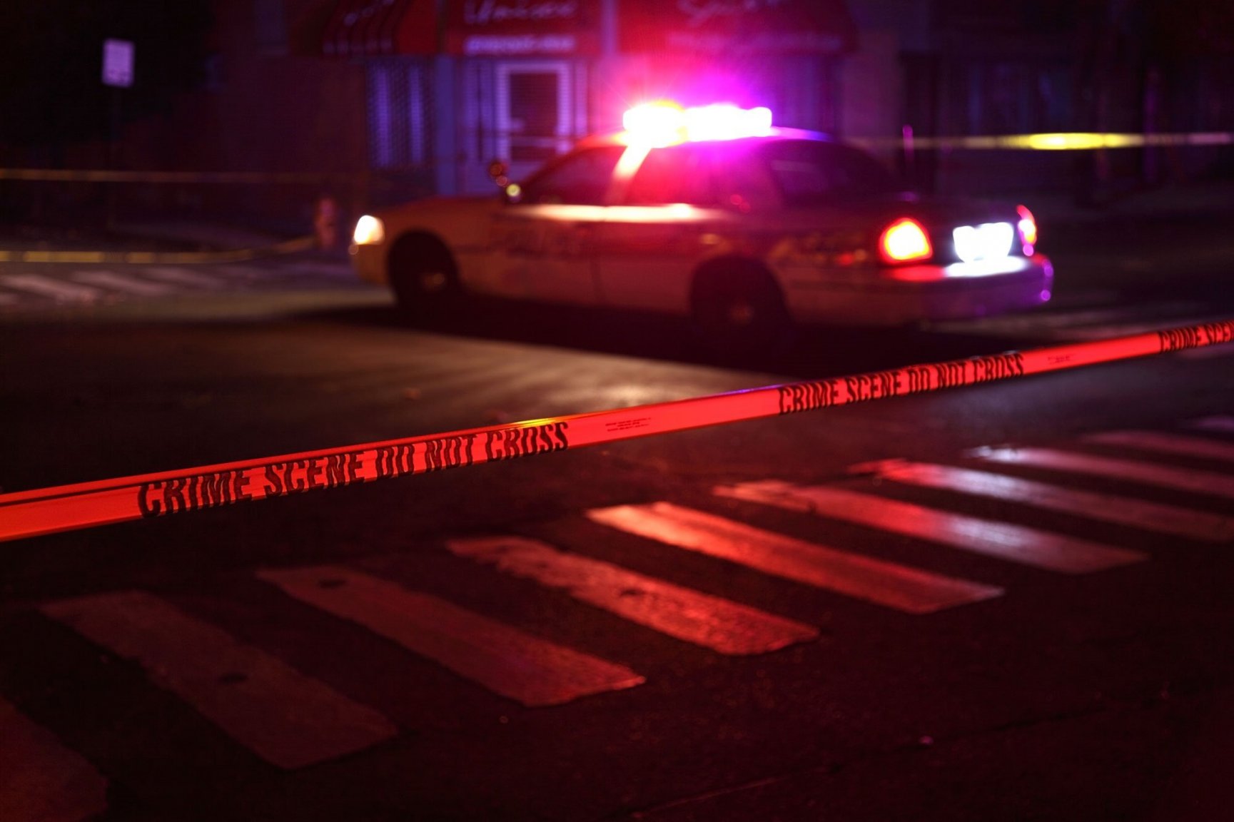 crime-scene-tape-and-police-car-at-night.jpg