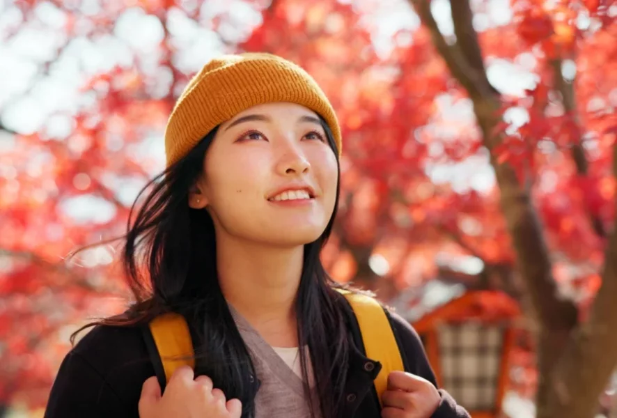 japanese-woman-travel-with-autumn-nature-trees-red-leaves-kyoto-forest-with-happiness-girl-smile-walk-park-woods-with-orange-environment-adventure-colorful-zen-garden-905x613.webp