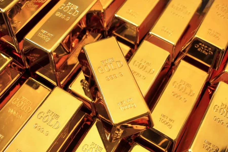 gold-bars-stacked-on-top-of-each-other-with-one-in-focus-in-the-middle.webp.f2ea6409479faafbf14f65ede8af9128.webp
