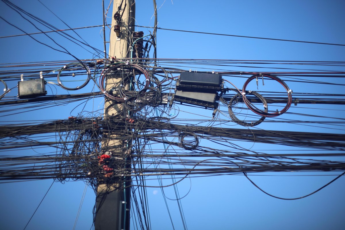 many-electrical-and-communication-cables-are-entangled-in-a-mess-on-the-power-poles-confusing-and-insecure-concept-to-operate-and-manage-the-system-free-photo.jpg