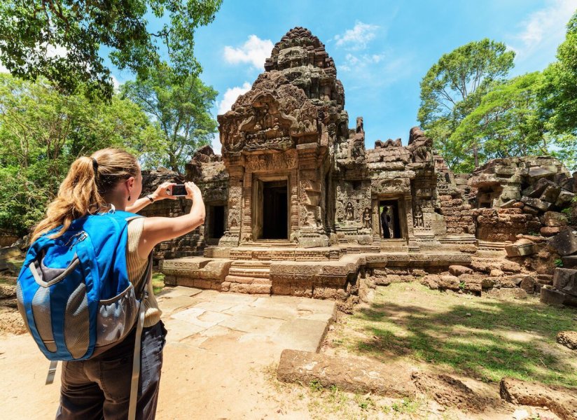 Female-tourist-taking-pictures-of-Preah-Khan-Temple-in-Angkor-Wat-Seam-Reap-Cambodia-1200x873.jpg