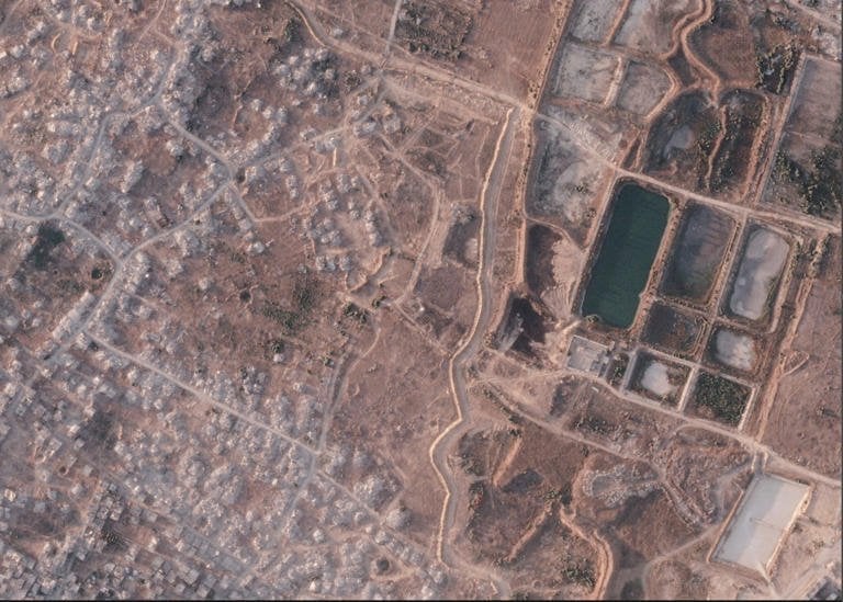 Israel expands vast earth barrier across Gaza