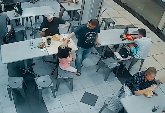 Singapore police investigate assault after a man patted a child's head